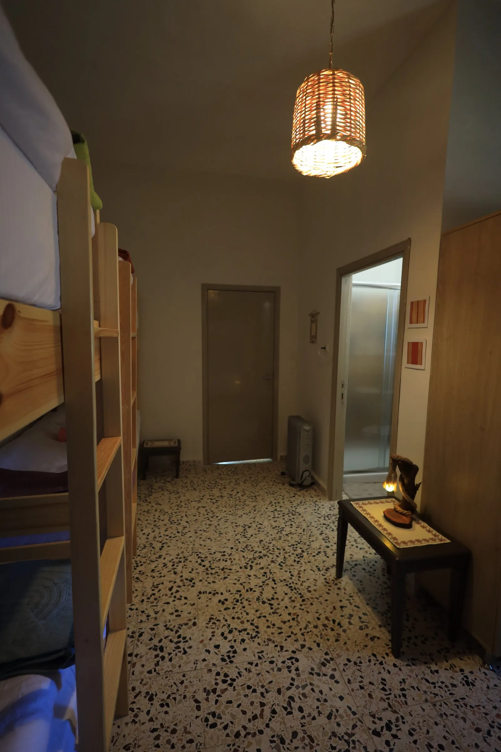 Bunk beds and a small table in the shared room